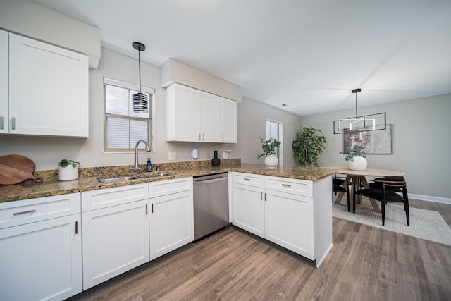 29 Victorian Gate Way, Columbus, OH 43215 - kitchen featuring stainless steel dishwasher, dark wood-style flooring, a peninsula, white cabinetry, and dark stone countertops
