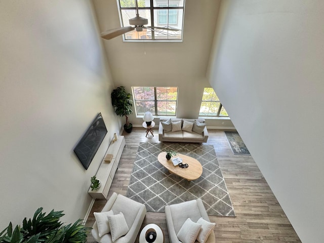 29 Victorian Gate Way, Columbus, OH 43215 - living area with a towering ceiling, ceiling fan, and wood finished floors