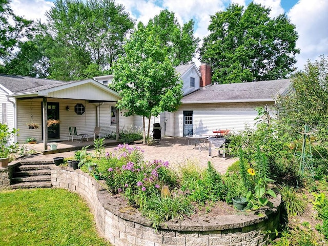 7860 Peter Hoover Rd, New Albany, OH 43054 - rear view of property featuring a patio area and a shingled roof