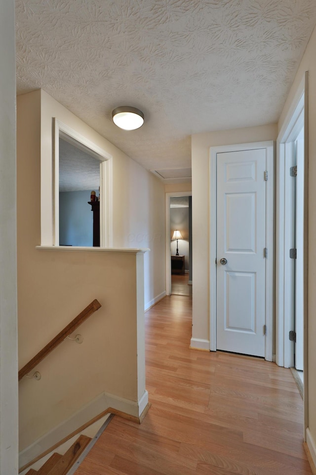 677 Fallside Ln, Westerville, OH 43081 - corridor featuring light wood-style floors and a textured ceiling