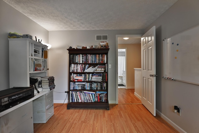 677 Fallside Ln, Westerville, OH 43081 - office area featuring a textured ceiling and light wood-style flooring
