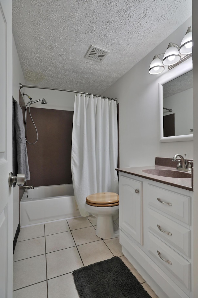677 Fallside Ln, Westerville, OH 43081 - full bath with tile patterned flooring, vanity, shower / tub combo with curtain, and a textured ceiling