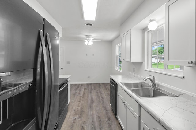 303 Rocky Fork Dr N, Columbus, OH 43230 - kitchen featuring fridge with ice dispenser, electric range oven, wood finished floors, and white cabinets