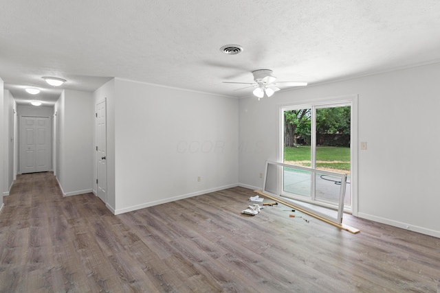 303 Rocky Fork Dr N, Columbus, OH 43230 - empty room featuring a ceiling fan, wood finished floors, and a textured ceiling