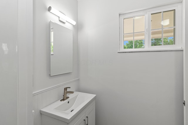 303 Rocky Fork Dr N, Columbus, OH 43230 - bathroom with vanity and a wainscoted wall