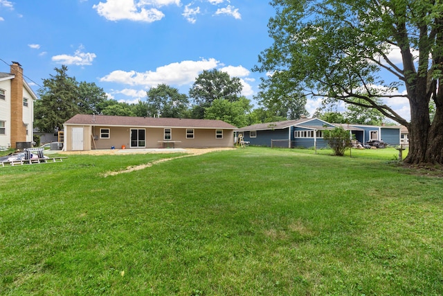 303 Rocky Fork Dr N, Columbus, OH 43230 - rear view of house featuring a patio and a yard