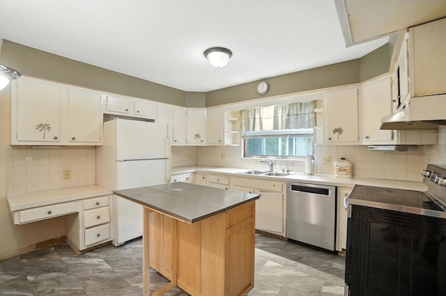 5050 Bixby Rd, Groveport, OH 43125 - kitchen with stainless steel dishwasher, electric range, freestanding refrigerator, and decorative backsplash