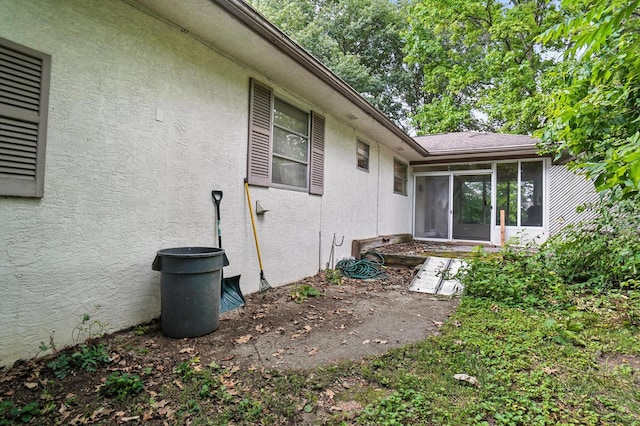 5050 Bixby Rd, Groveport, OH 43125 - view of side of property featuring stucco siding and a sunroom