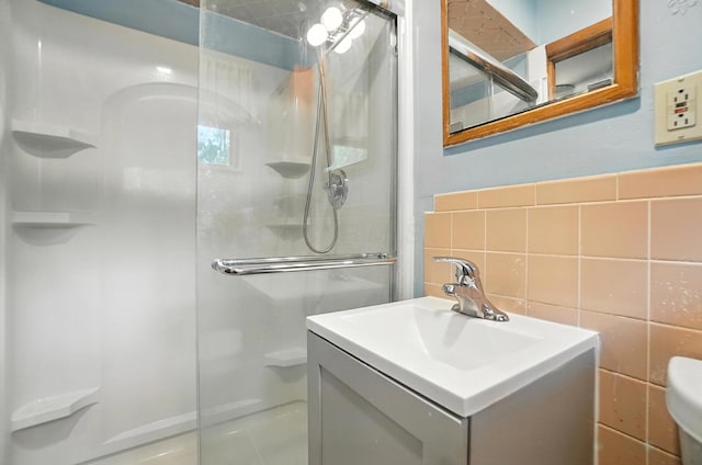 5050 Bixby Rd, Groveport, OH 43125 - bathroom featuring a stall shower, vanity, and tile walls