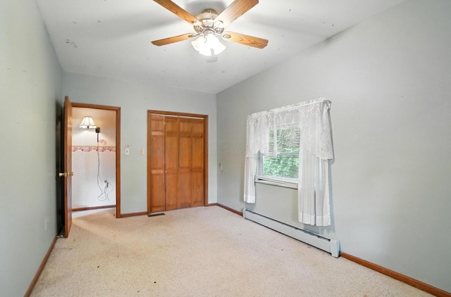 5050 Bixby Rd, Groveport, OH 43125 - unfurnished bedroom featuring baseboard heating, light carpet, a closet, and ceiling fan