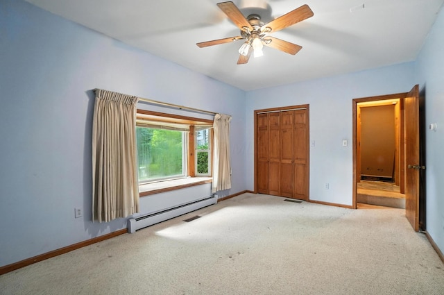5050 Bixby Rd, Groveport, OH 43125 - unfurnished bedroom featuring a baseboard radiator, carpet, ceiling fan, and a closet
