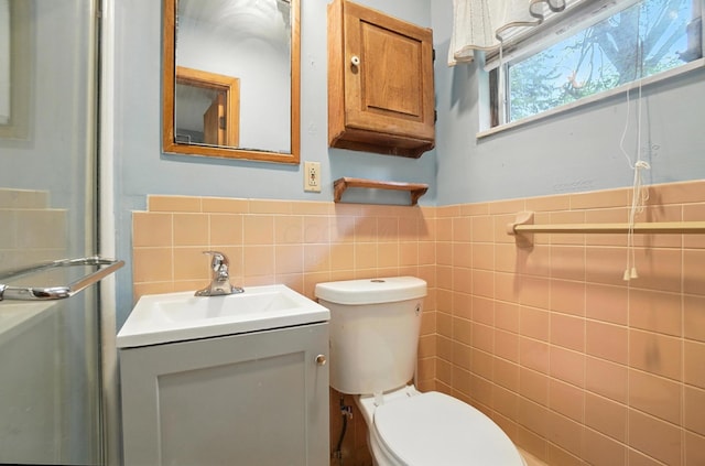 5050 Bixby Rd, Groveport, OH 43125 - bathroom featuring tile walls, vanity, and wainscoting