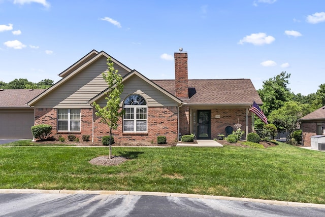 2919 Laurel Wind Blvd, Lewis Center, OH 43035 - ranch-style home with a chimney, a front yard, and brick siding