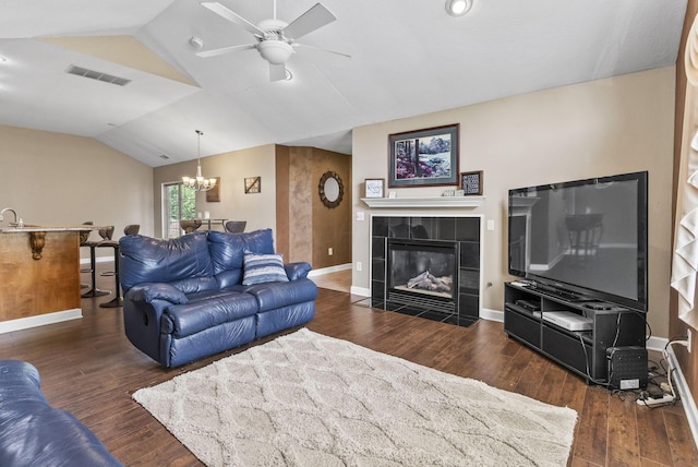 2919 Laurel Wind Blvd, Lewis Center, OH 43035 - living room with lofted ceiling, ceiling fan, a chandelier, wood finished floors, and a tiled fireplace