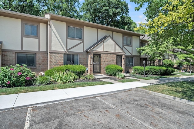 3254 Brookview Way Unit 15, Columbus, OH 43221 - view of front facade with brick siding, stucco siding, and uncovered parking