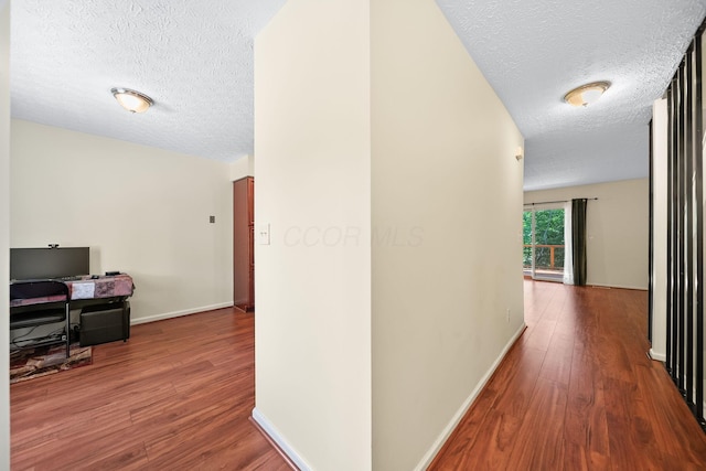 3254 Brookview Way Unit 15, Columbus, OH 43221 - corridor featuring a textured ceiling and wood finished floors