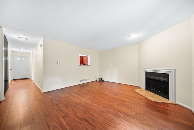3254 Brookview Way Unit 15, Columbus, OH 43221 - unfurnished living room with wood finished floors and a fireplace