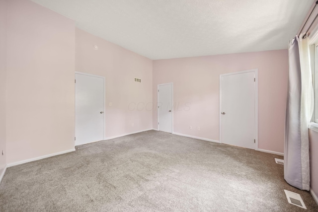3254 Brookview Way Unit 15, Columbus, OH 43221 - carpeted empty room with baseboards and a textured ceiling