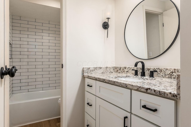 5110 Schuylkill St Unit 33-10, Columbus, OH 43220 - bathroom with vanity, wood finished floors, and bathing tub / shower combination