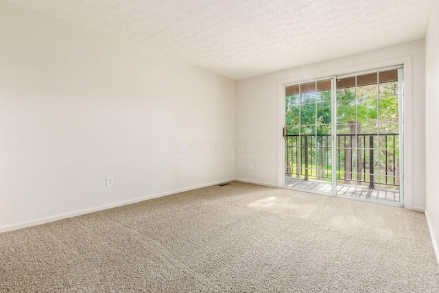 5110 Schuylkill St Unit 33-10, Columbus, OH 43220 - carpeted empty room featuring baseboards and a textured ceiling