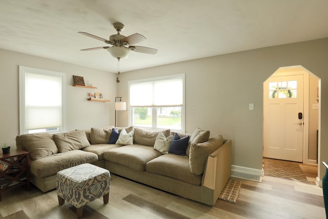 822 Rutter Ave, Lancaster, OH 43130 - living room featuring light wood finished floors, ceiling fan, and arched walkways