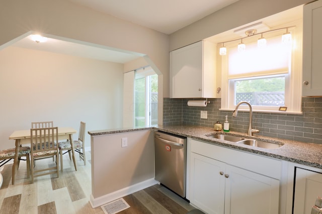 822 Rutter Ave, Lancaster, OH 43130 - kitchen with dishwasher, wood finished floors, light stone counters, white cabinets, and backsplash