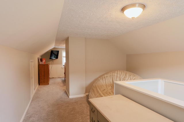 822 Rutter Ave, Lancaster, OH 43130 - bedroom with light colored carpet, lofted ceiling, and a textured ceiling