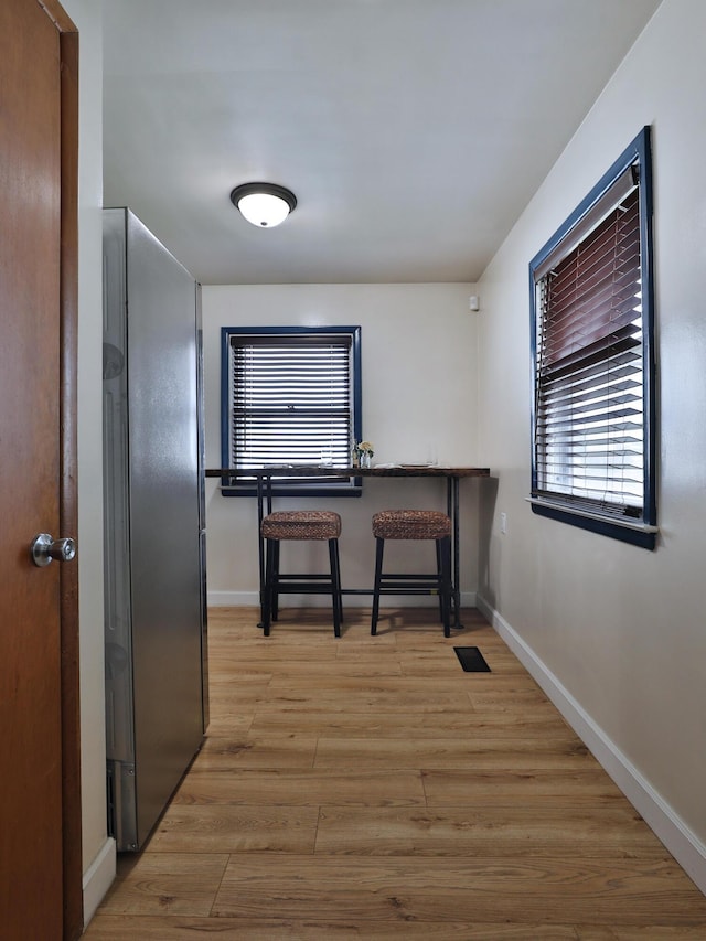 69 Morse Rd, Columbus, OH 43214 - hall with baseboards and light wood finished floors