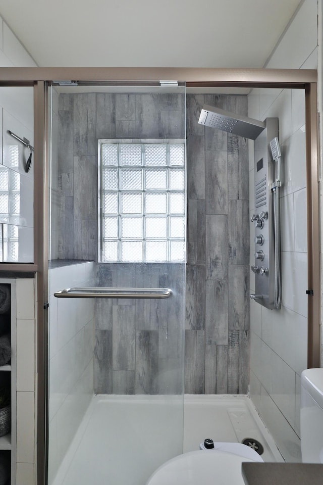 69 Morse Rd, Columbus, OH 43214 - bathroom with a shower stall and toilet