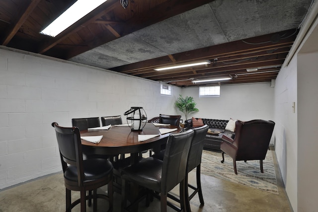 69 Morse Rd, Columbus, OH 43214 - dining area with concrete flooring and concrete block wall