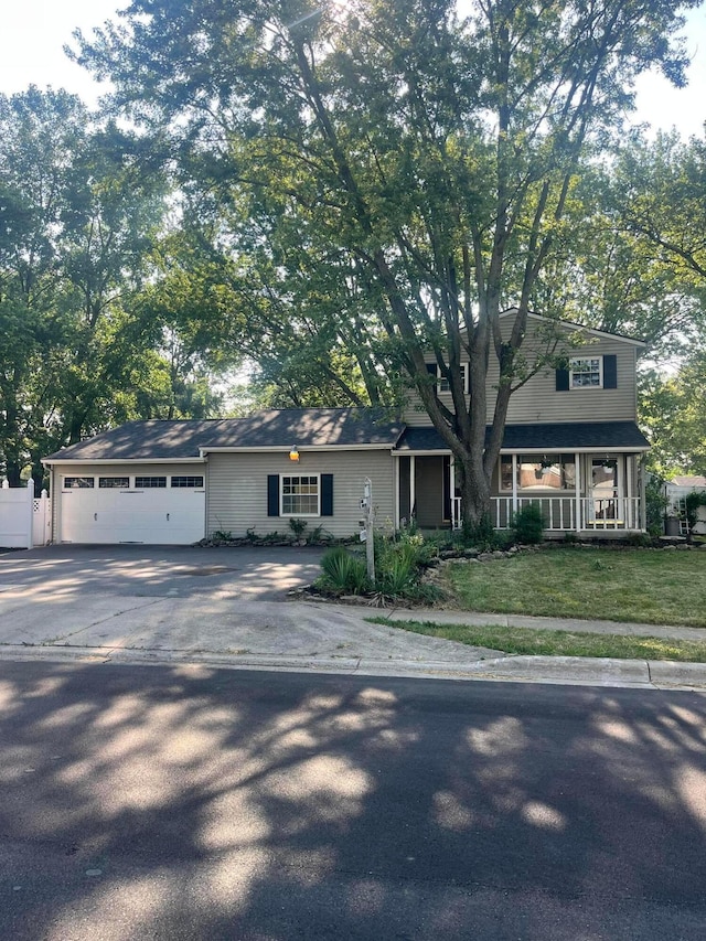 190 Inah Ave, Columbus, OH 43228 - view of front facade with concrete driveway, a garage, and covered porch