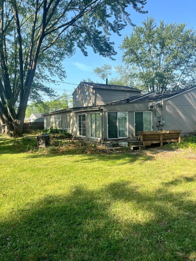 190 Inah Ave, Columbus, OH 43228 - back of house with a sunroom, a lawn, and a wooden deck