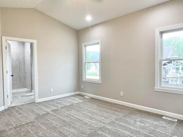 32366 Lilac Ln, Logan, OH 43138 - unfurnished bedroom with carpet flooring, ensuite bath, and lofted ceiling