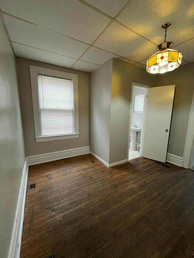 2395 Summit St, Columbus, OH 43202 - unfurnished dining area featuring baseboards and wood finished floors
