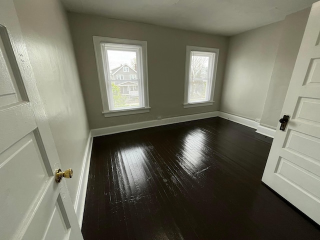 2395 Summit St, Columbus, OH 43202 - empty room featuring dark wood-type flooring and baseboards