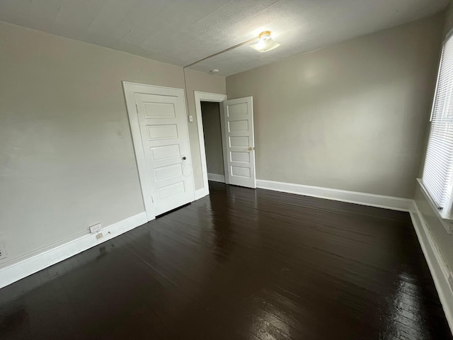 2395 Summit St, Columbus, OH 43202 - empty room featuring dark wood-style floors and baseboards