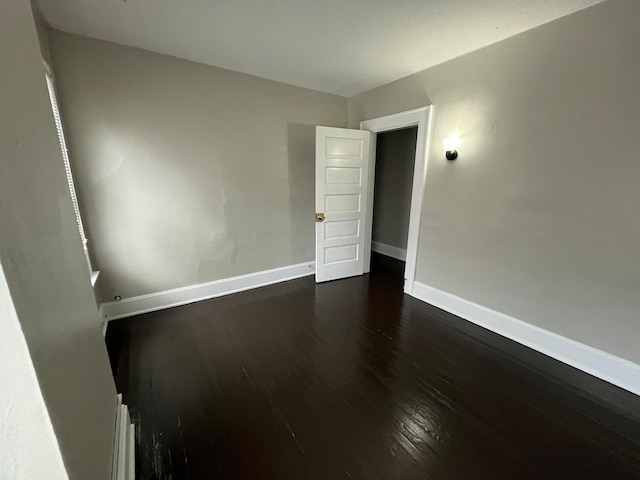 2395 Summit St, Columbus, OH 43202 - unfurnished room with dark wood-style flooring and baseboards