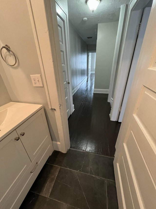 2395 Summit St, Columbus, OH 43202 - hall with baseboards and a textured ceiling