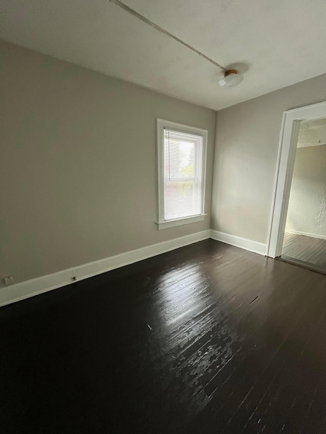 2395 Summit St, Columbus, OH 43202 - unfurnished room featuring dark wood finished floors and baseboards