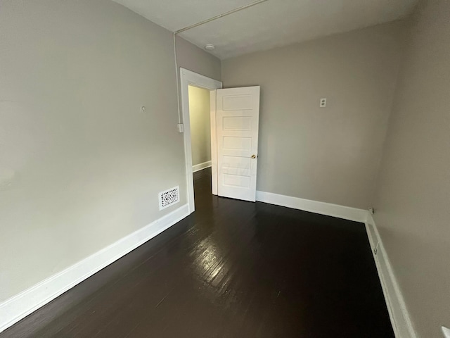 2395 Summit St, Columbus, OH 43202 - spare room featuring dark wood-type flooring and baseboards
