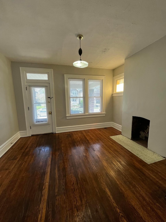 2395 Summit St, Columbus, OH 43202 - unfurnished living room with dark wood-style flooring and a fireplace with flush hearth