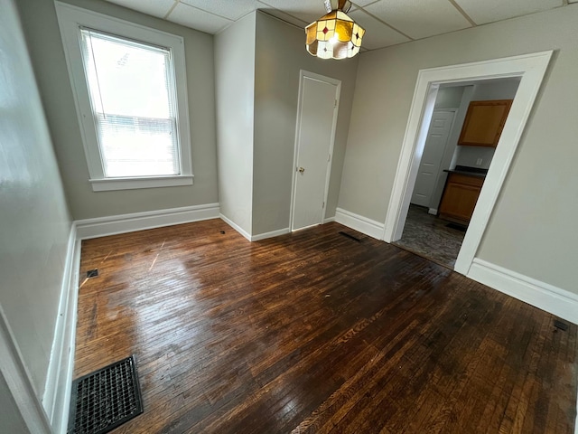 2395 Summit St, Columbus, OH 43202 - empty room with wood-type flooring and a drop ceiling