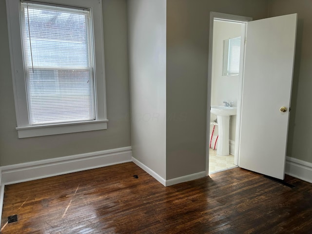 2395 Summit St, Columbus, OH 43202 - spare room featuring wood finished floors and baseboards