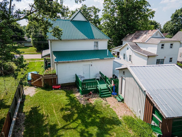 83 2nd St, Shelby, OH 44875 - rear view of property featuring a metal roof and a deck