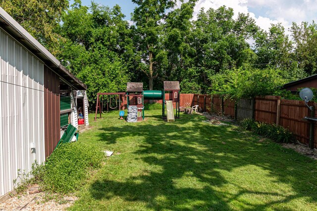 83 2nd St, Shelby, OH 44875 - fenced backyard with a playground and view of scattered trees