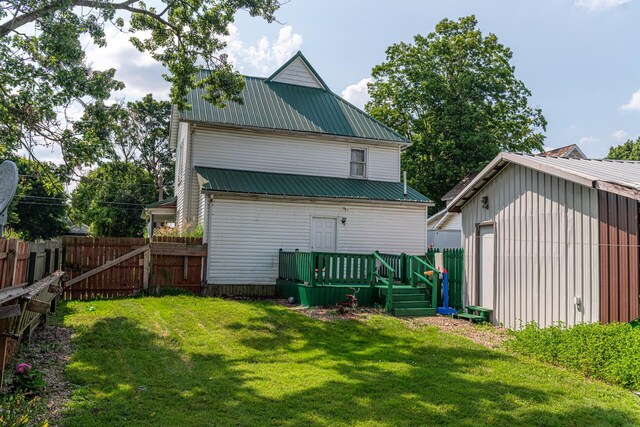83 2nd St, Shelby, OH 44875 - back of property featuring a metal roof and a wooden deck
