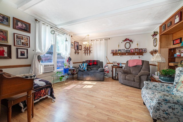 83 2nd St, Shelby, OH 44875 - living area with beam ceiling, light wood-type flooring, a chandelier, and cooling unit