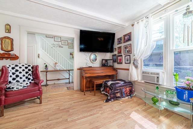 83 2nd St, Shelby, OH 44875 - sitting room featuring stairway, wood finished floors, and beamed ceiling