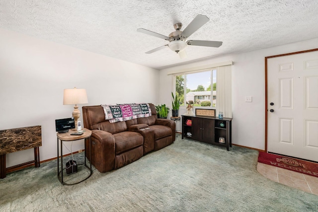 2197 Bayfield Dr, Columbus, OH 43229 - living area with carpet floors, a ceiling fan, and a textured ceiling