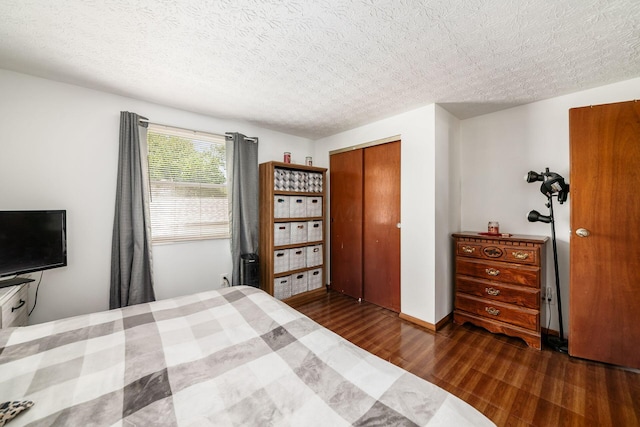 2197 Bayfield Dr, Columbus, OH 43229 - bedroom featuring dark wood-style floors and a closet